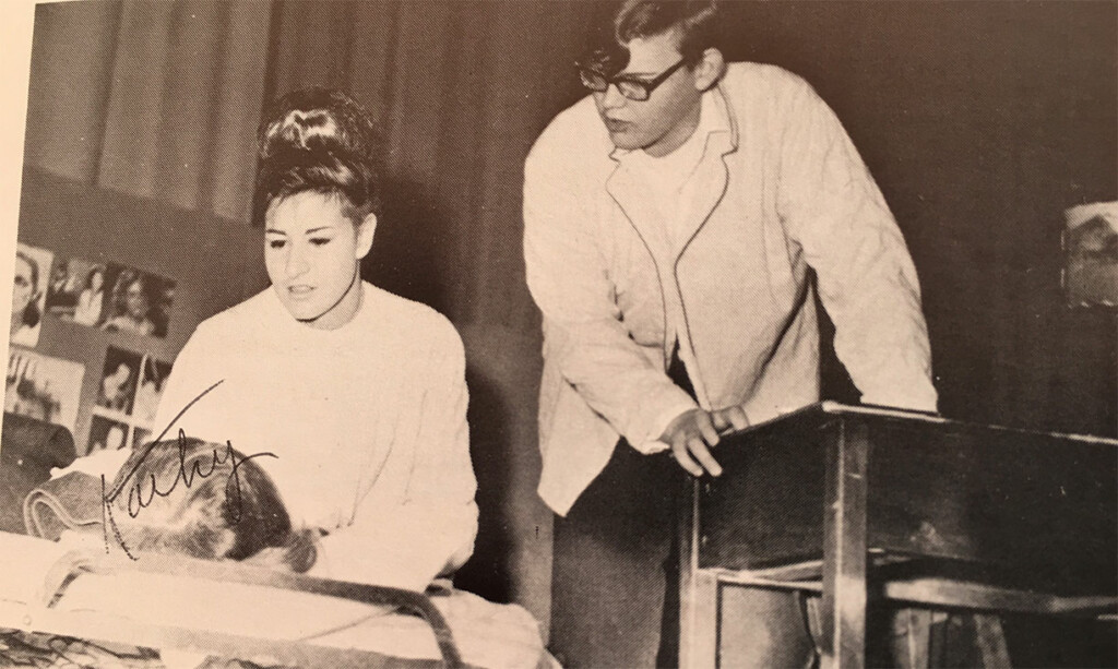 Two people on a stage.