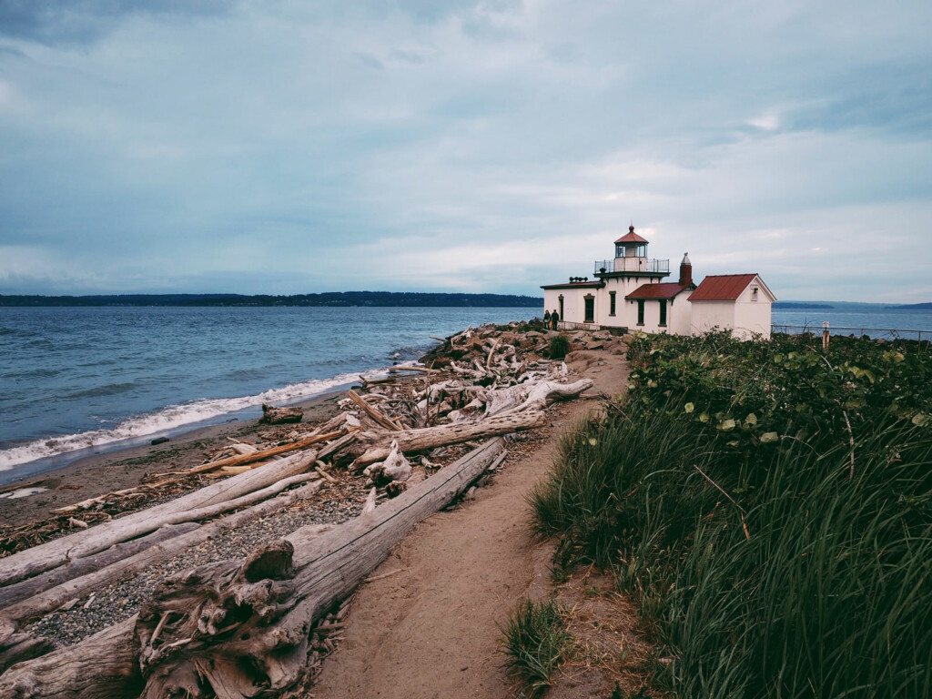 A lighthouse on a beach.