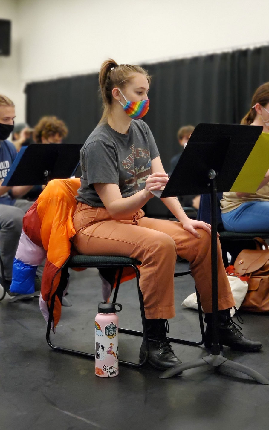 A group of people in a rehearsal space.