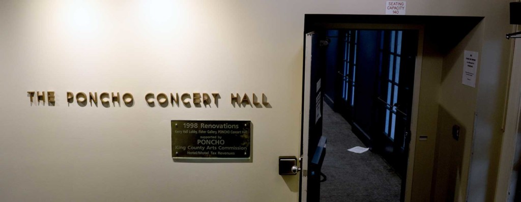 Entrance to Poncho Concert Hall showing decorative lettering and a commemorative plaque