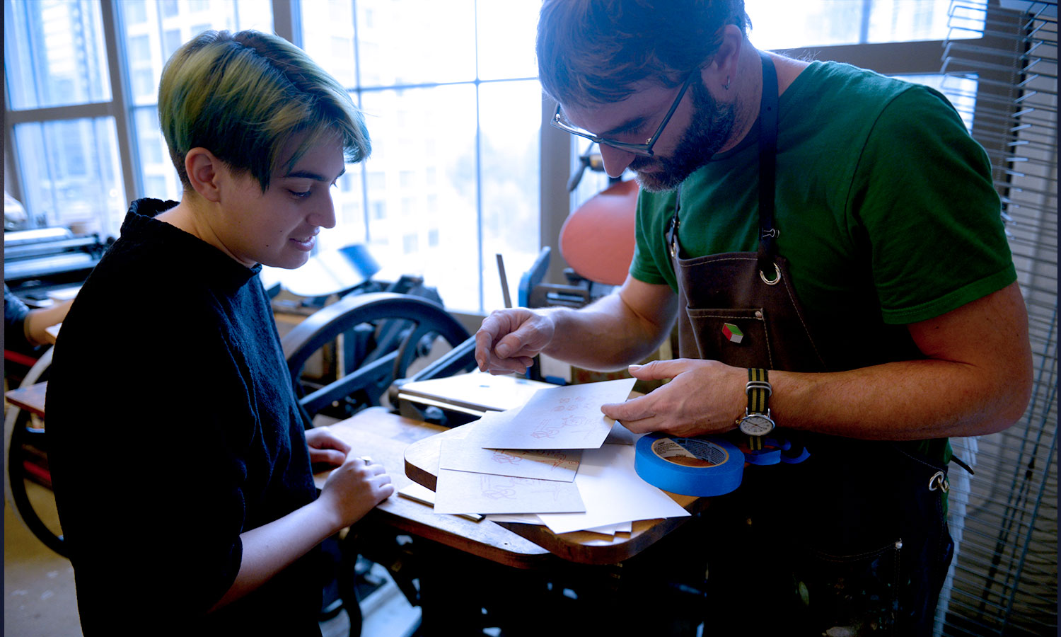 student and teacher working