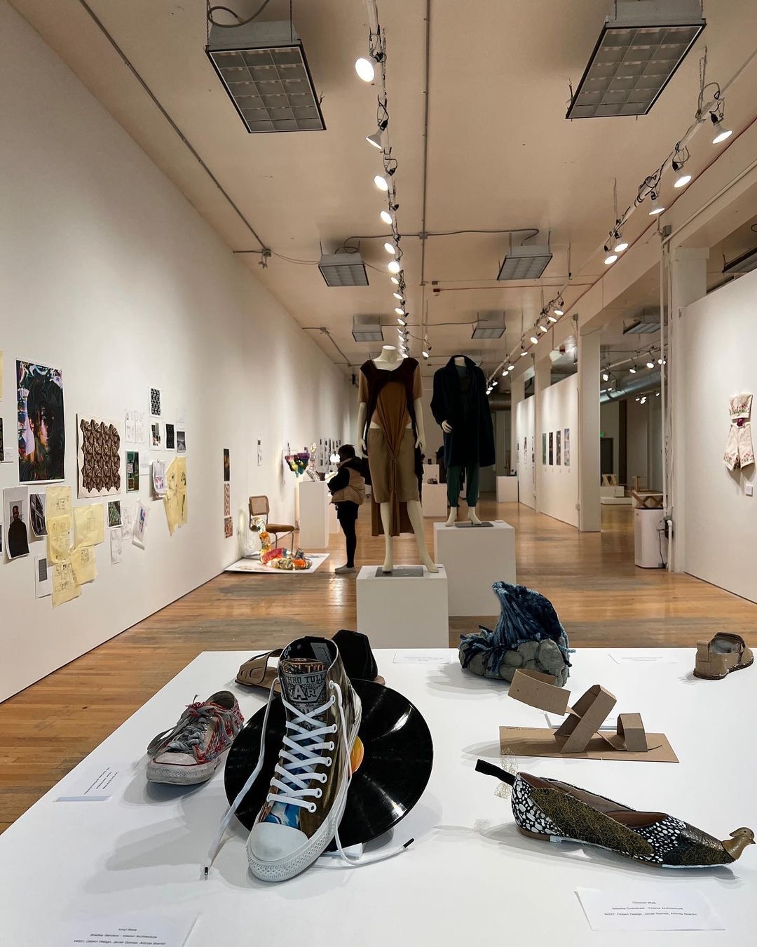 A gallery display of shoes and clothes.