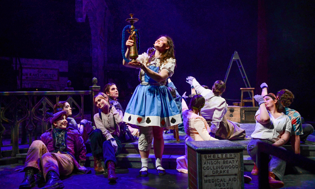 Alice and the cast on stage