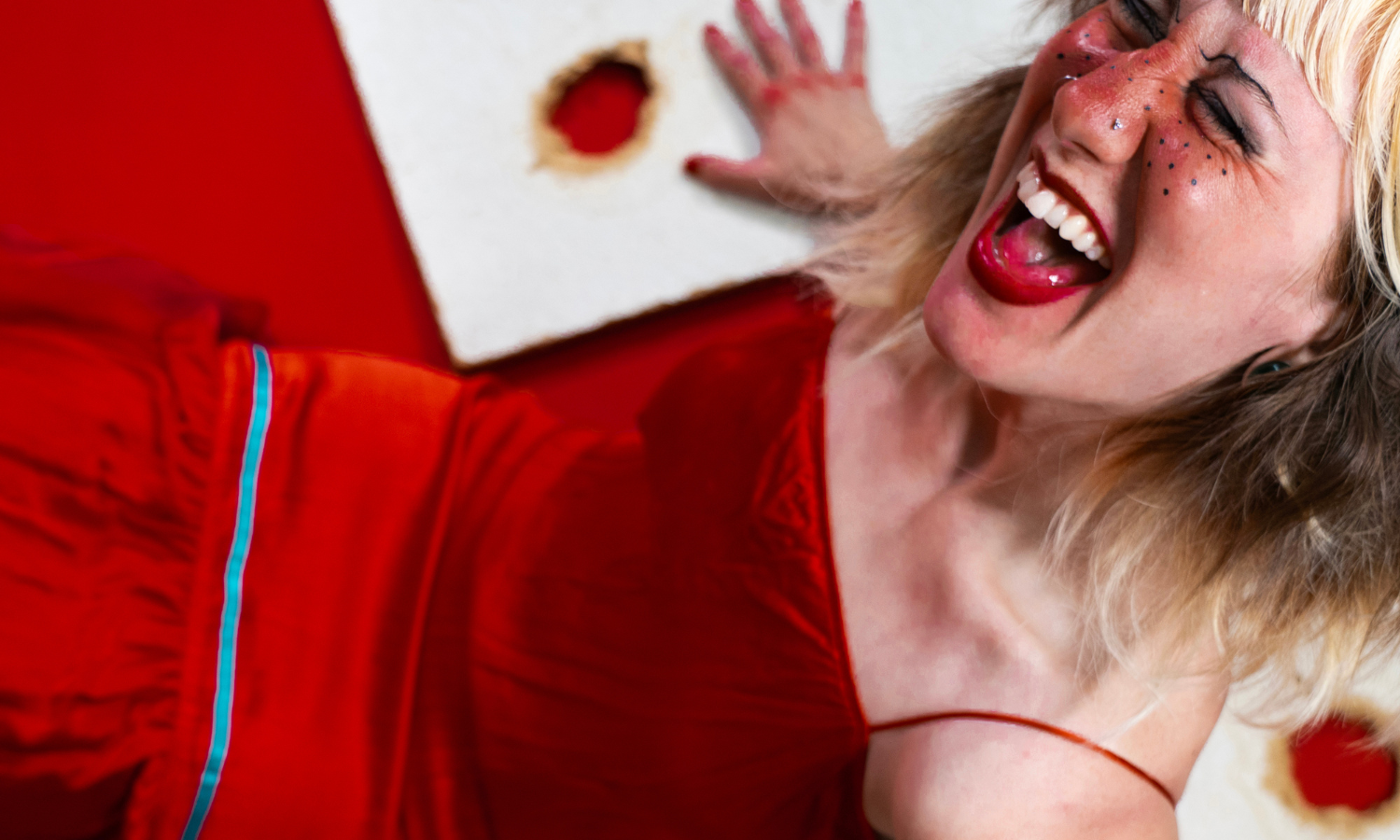 close up of artist in red