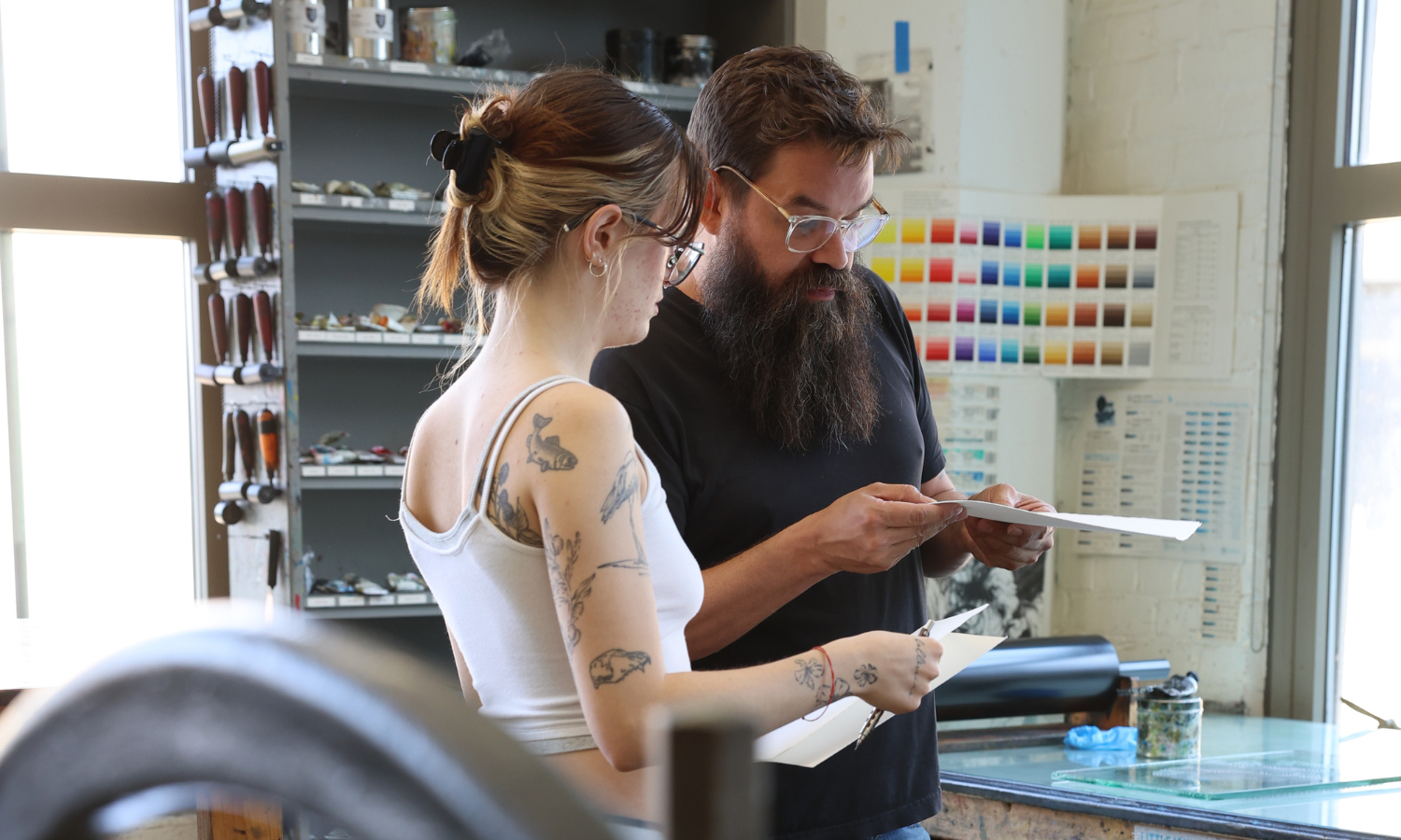 Photo of a Cornish faculty member helping a student in the Cornish Print Studio